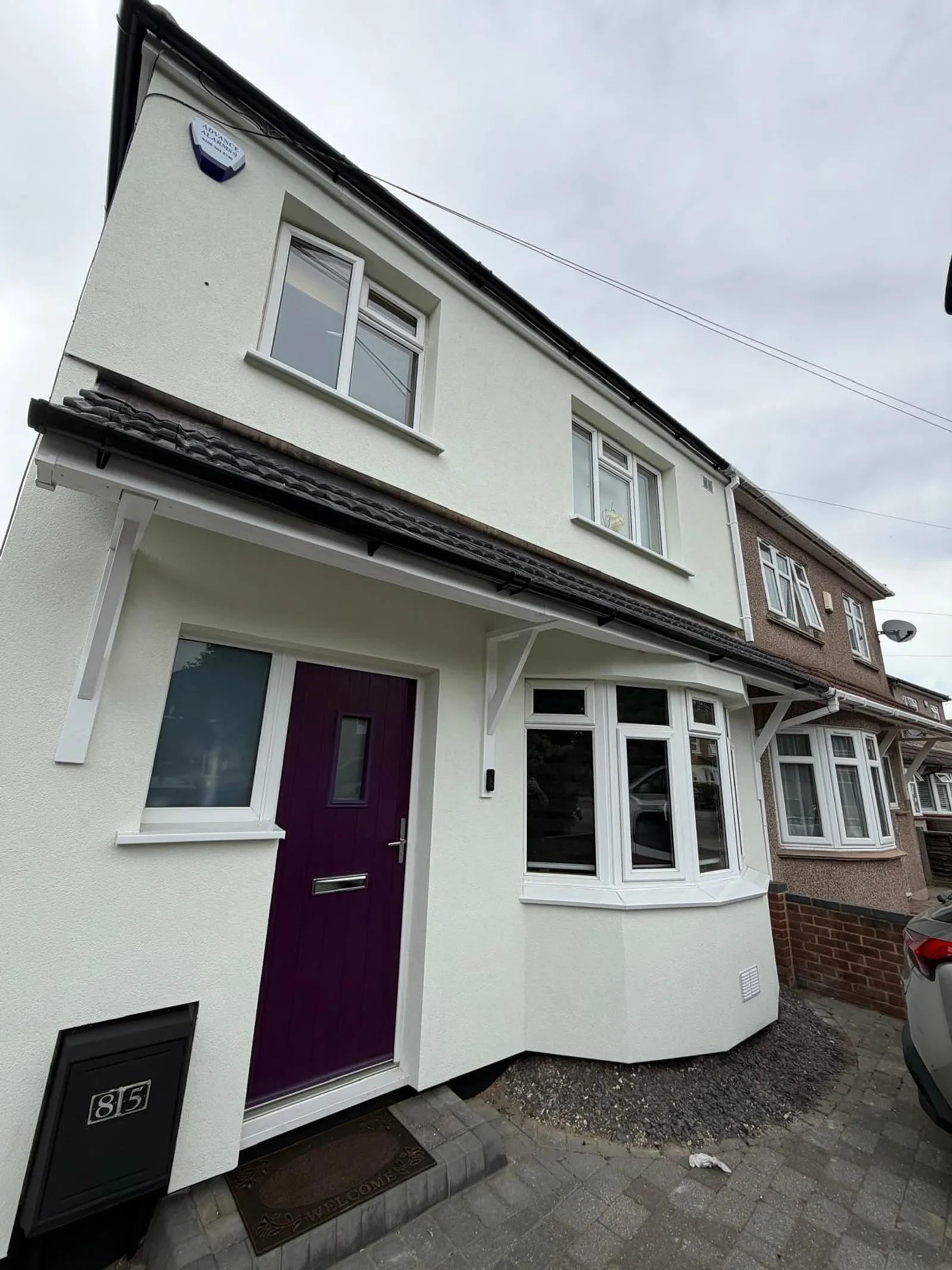 Freshly completed external wall insulation and silicone render finish on a South East London home
